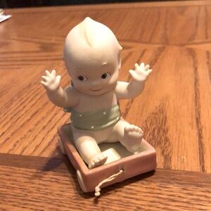KEWPIE BABY SITTING IN FLYER WAGON by ENESCO NEW CONDITION